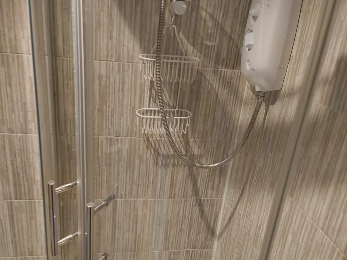 Spotless shower enclosure after a Bethel deep clean in London