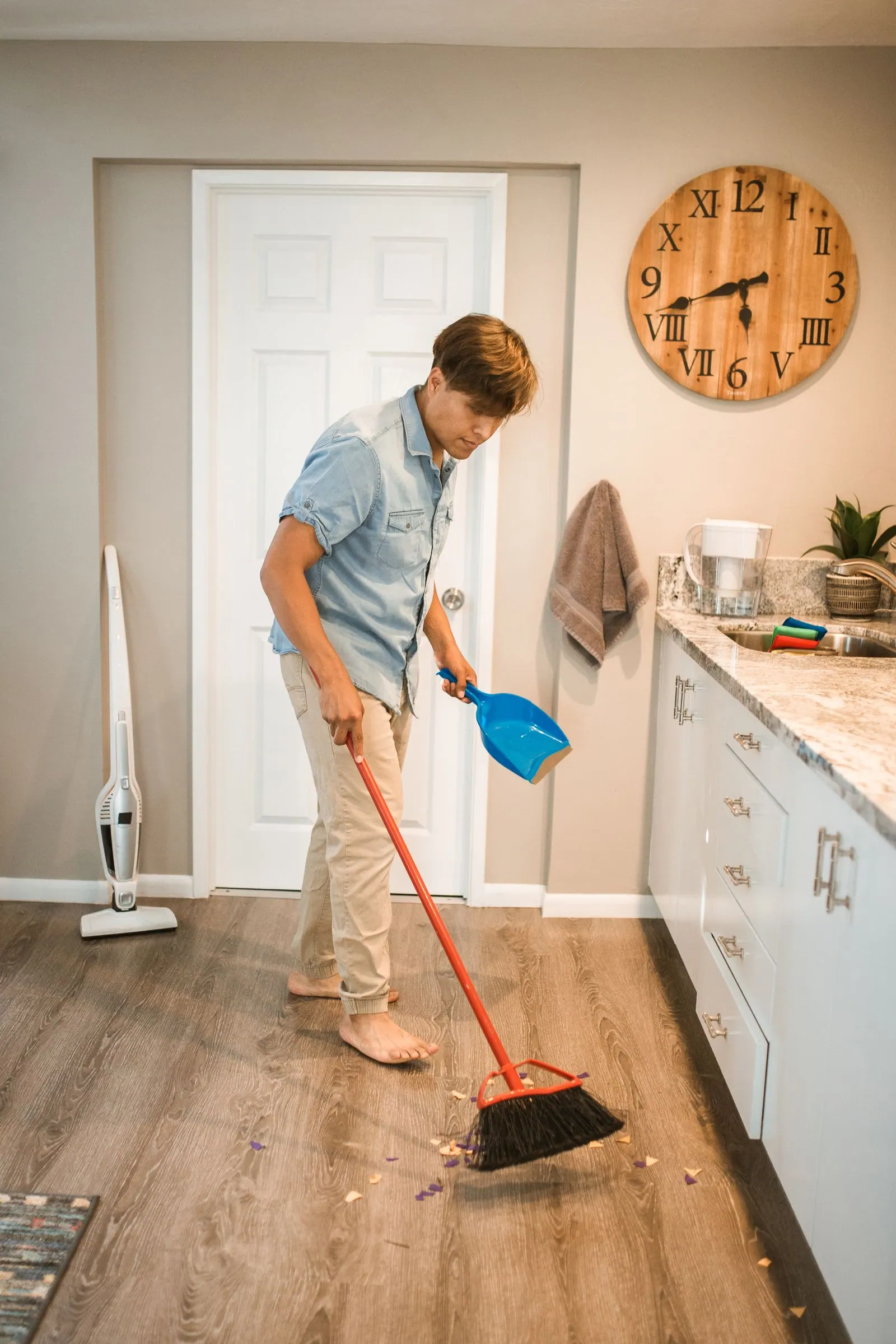 Cleaner sweeping a property ready for the next tenant