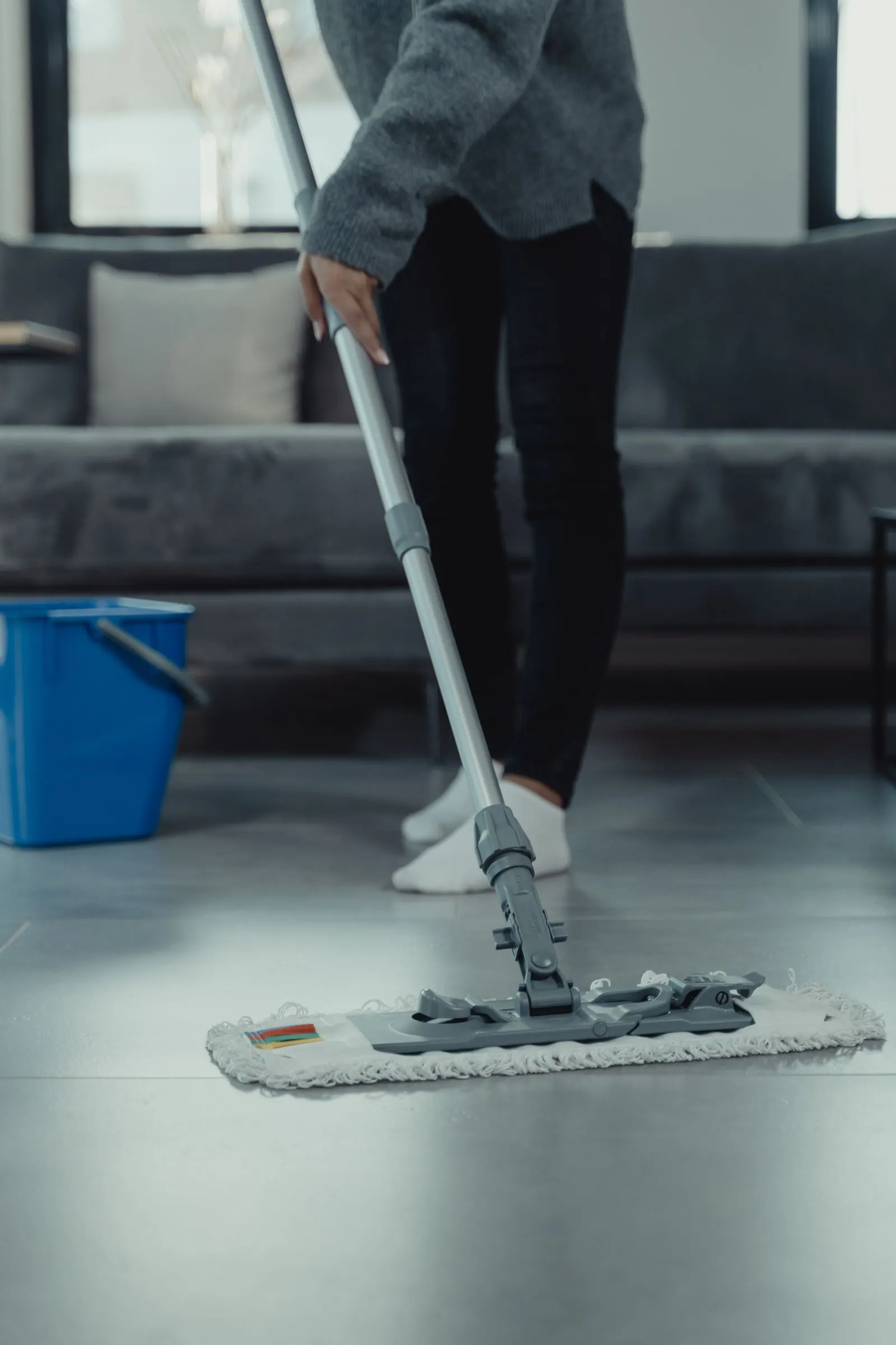Cleaner mopping a communal floor in student accommodation