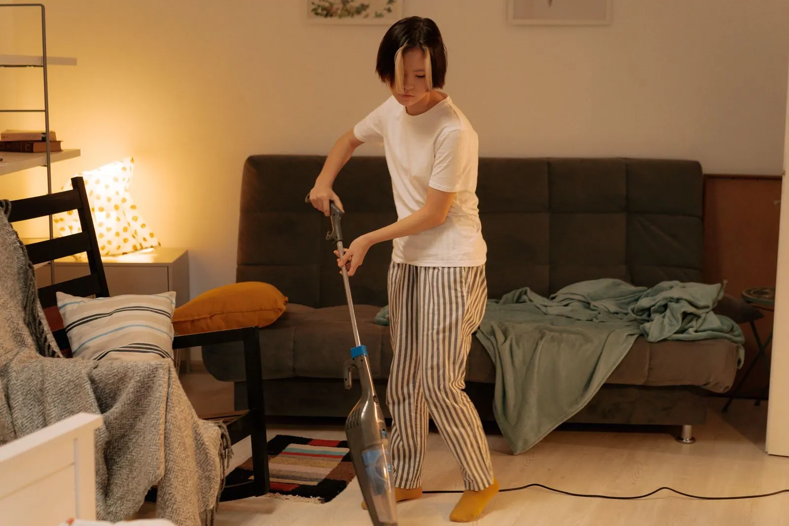 Professional cleaner vacuuming a tidy London living space